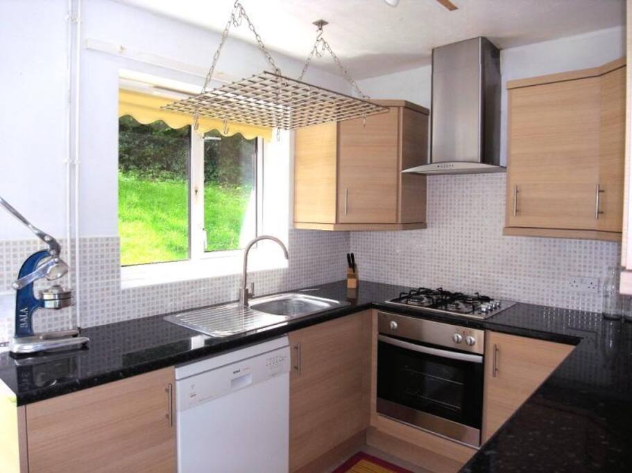 kitchen with dishwasher, oven, cooker, microwave