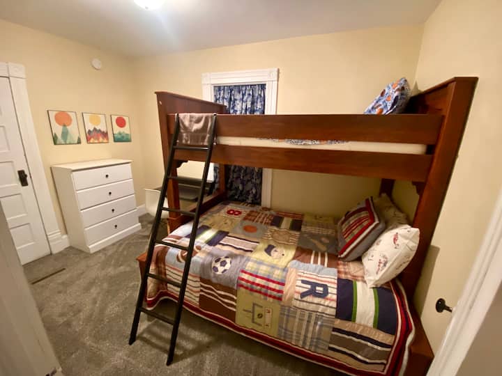 Full bed on lower and twin on top. Large dresser and walk-in closet or kids hide away area. 