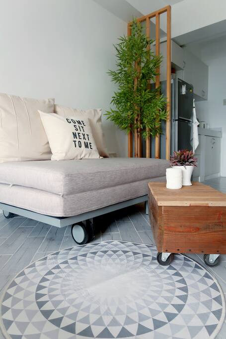 Lounge by the living room during the day and convert it to a bed at night if there's more than two of you