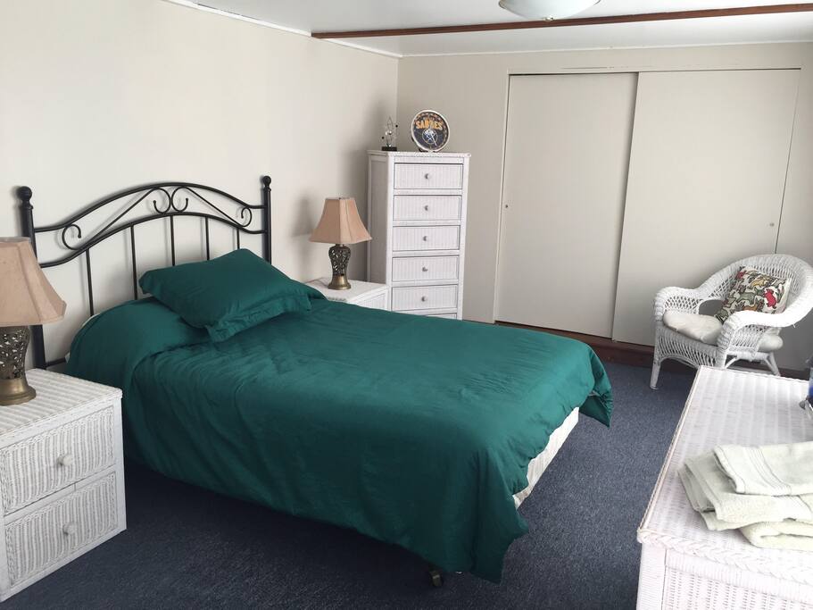 A full bed in a sunny room.