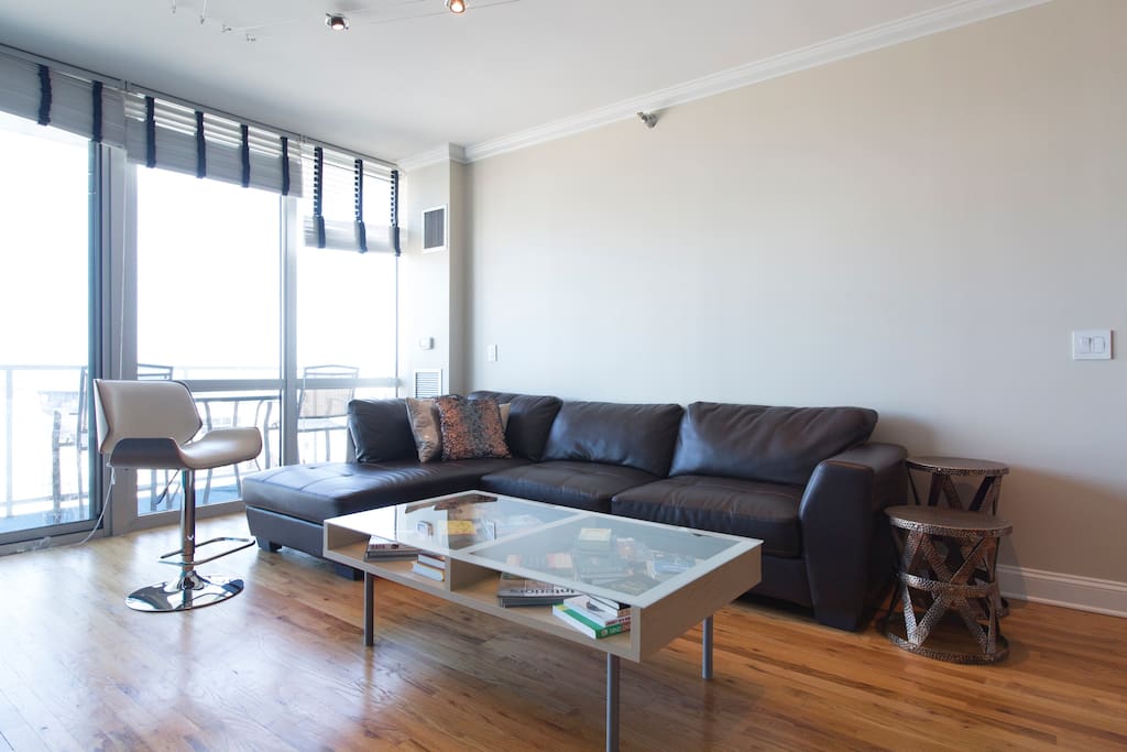 Cozy living room with leather sectional and coffee table.
Life your feet up and make yourself at home