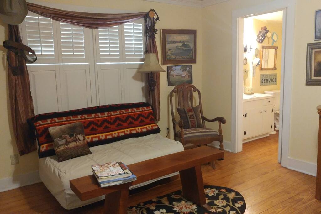Sofa makes full size roll-out bed, and along with rocker offer good conversation or TV viewing area