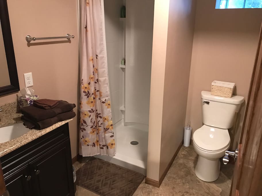 Private bathroom with shower and sink