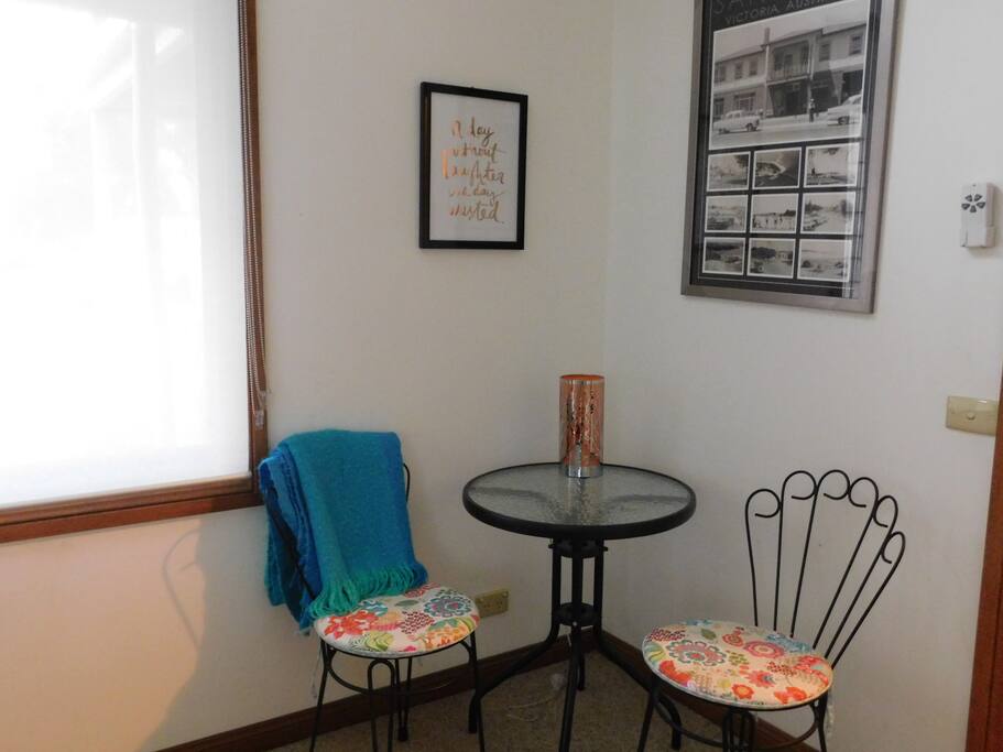 Extra touches like this table and chairs give you that little taste of home away from home.
