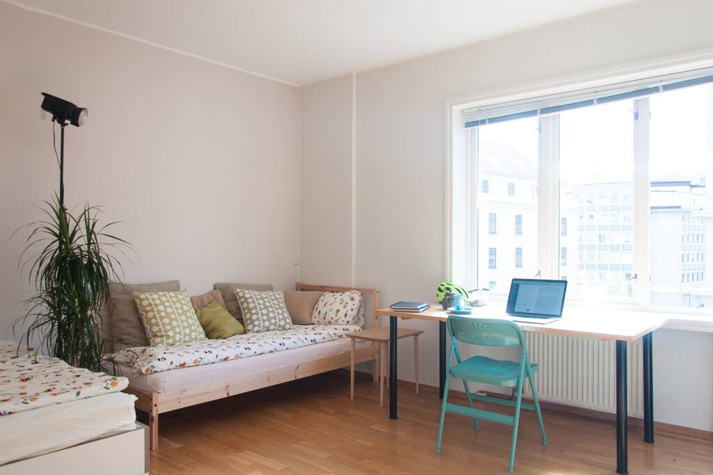 Bedroom working desk and bed.