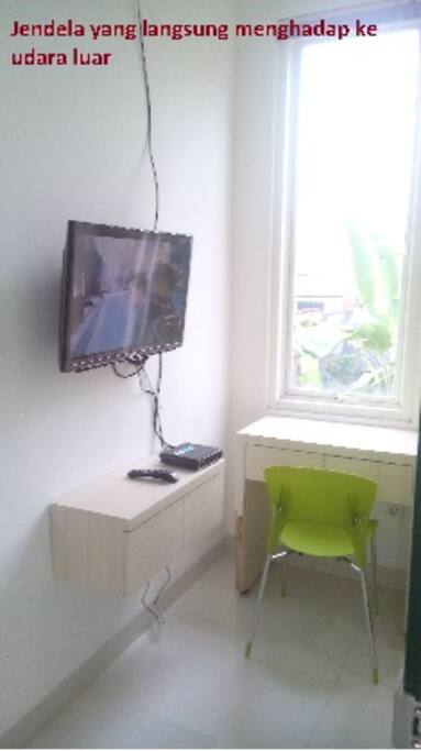 Chair and desk, with a window accessing directly to outside