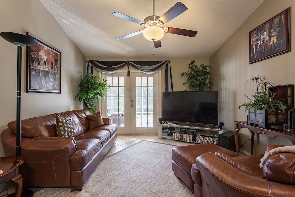 Den/Family Room. French doors lead to covered, screened in lanai