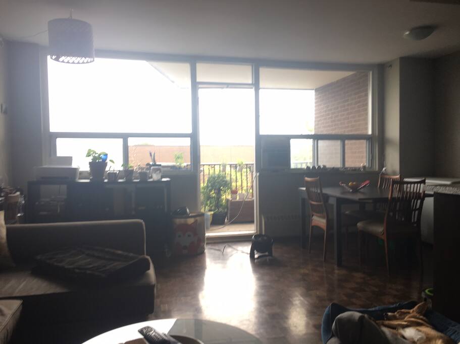 Living room looking to dining room and balcony