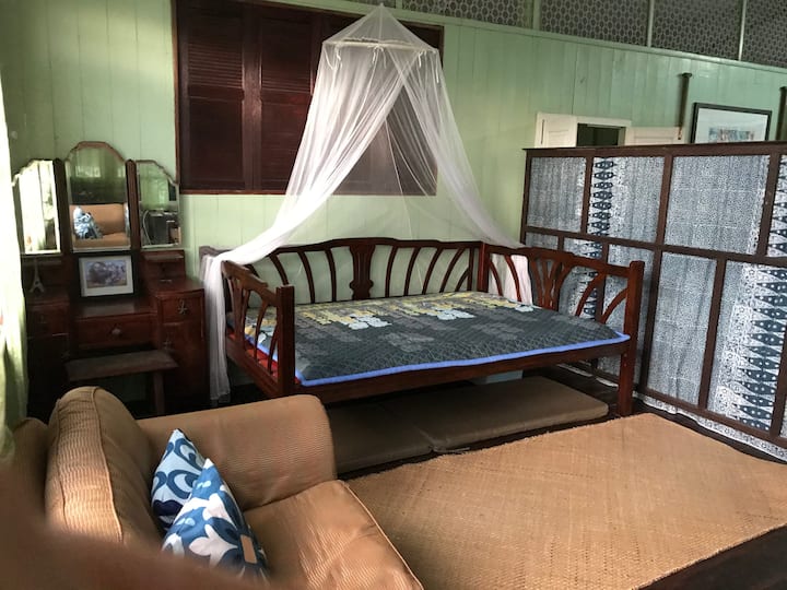 A flexible sleeping zone (Bedroom 2) located within the open concept living area