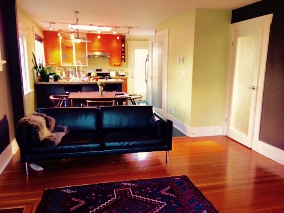 Open concept modern living room, dining room and kitchen.