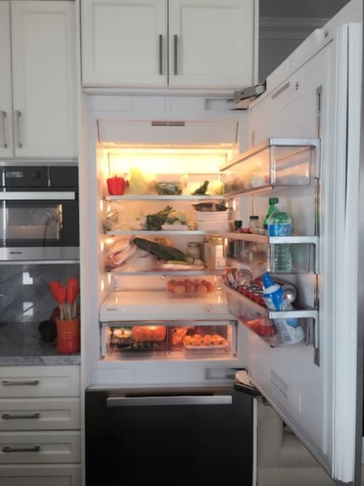 Kitchen: Instant Filtered Cold/Hot water, Breakfast Bar, Dishwasher, Induction Cooktop, Microwave, Oven, Bar Stool
