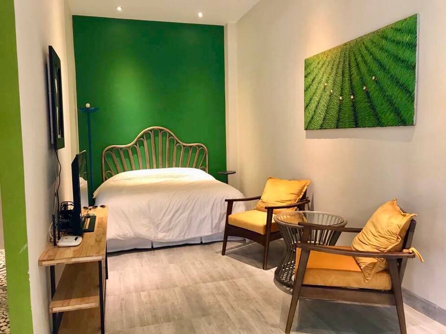 Tropical room on 1st floor with a large window looking outside