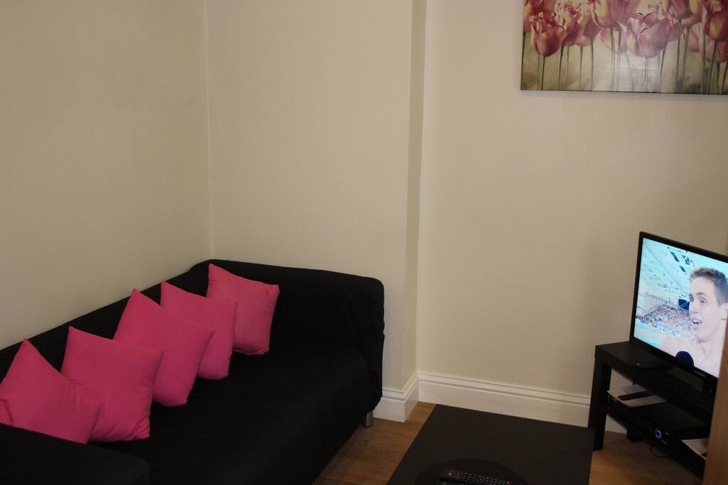At one end of the main room is a small sitting area with TV + dvds