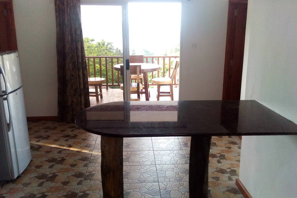 Granite bar in kitchen with sea views