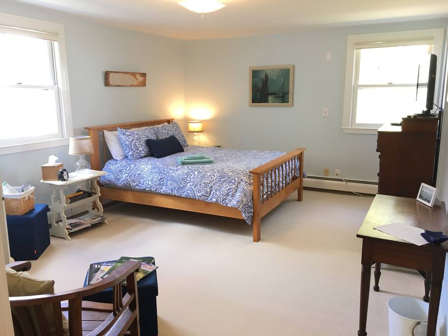 The suite has everything you need: a TV, small desk, and a seating area