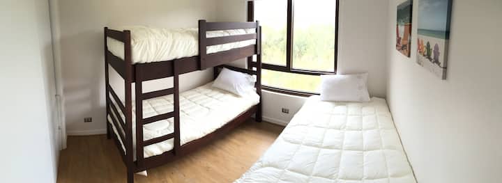 Third bedroom overlooking the hill, a double bed and a 1-bed cabin.