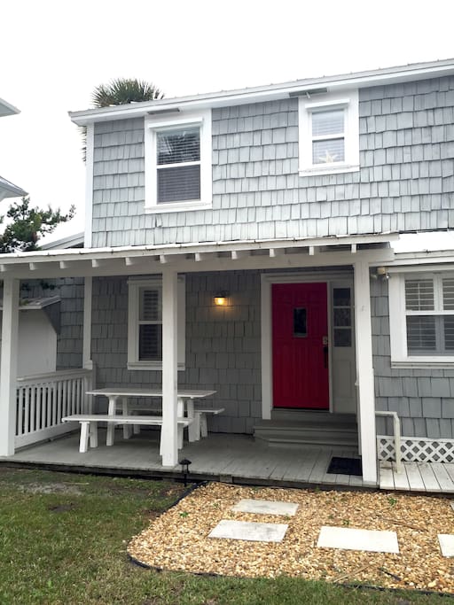 Our red front door located on Ocean Dr with a 2 car driveway