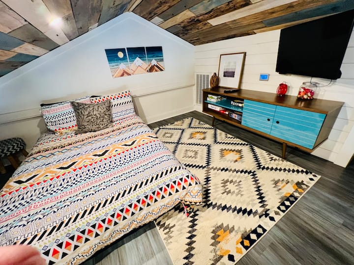 Loft bedroom with TV