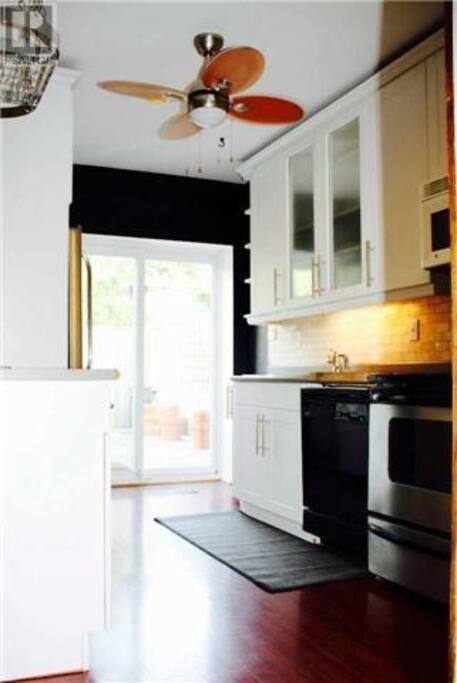 Kitchen with exit to the lower of the two decks