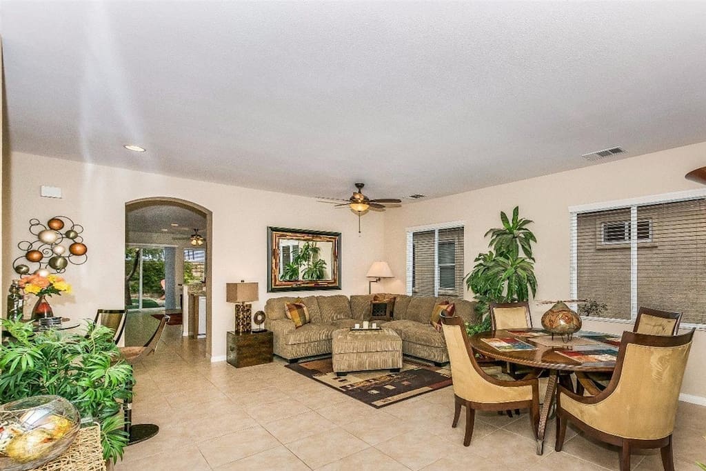 Living room has a very comfortable sectional sofa and ottoman