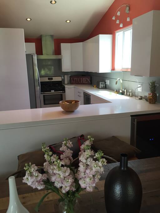 Fully stocked white kitchen.