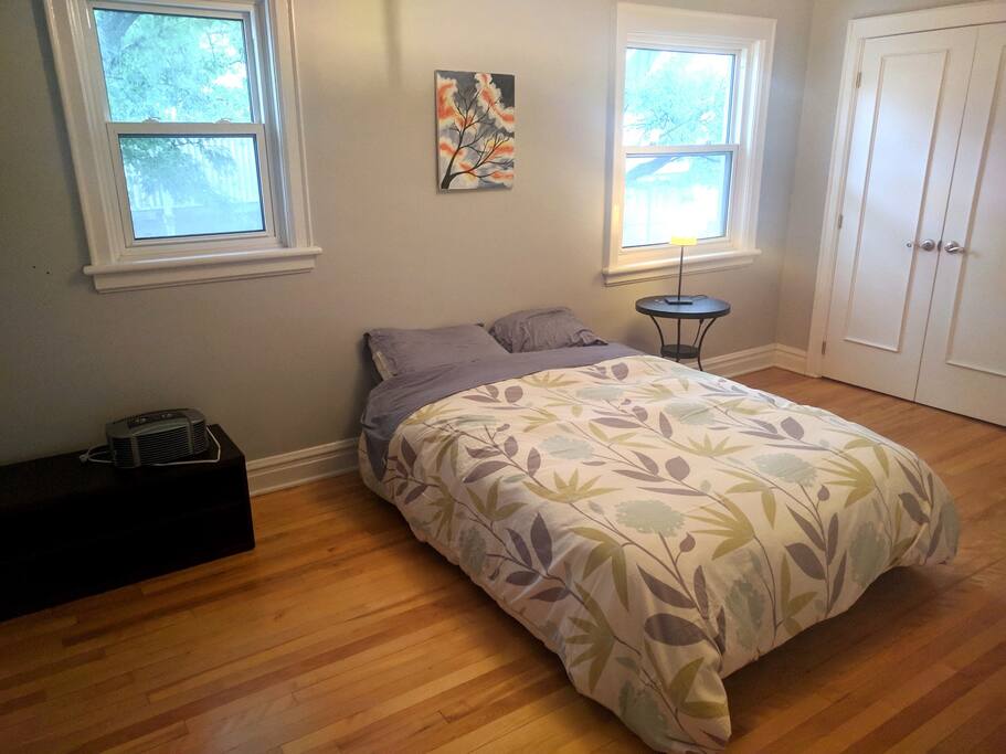 The Gum Tree Saloon. Double bed and a closet with shelves and hanging space.