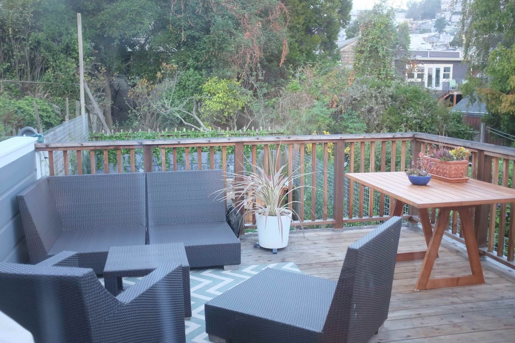 Private outdoor deck has places to relax with a book or eat meals outside