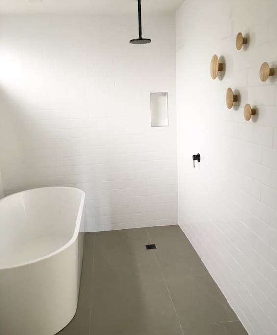 Open wet room , with high quality finishes and deep soaker bathtub, ideal for relaxing with a wine