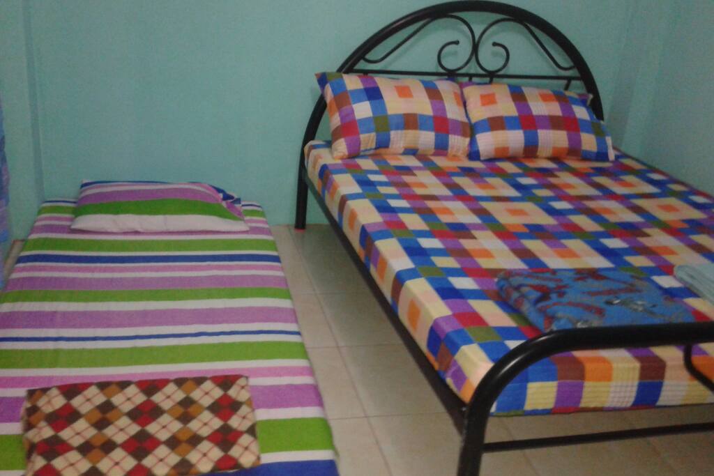 The bedroom is big enough to add another bed.