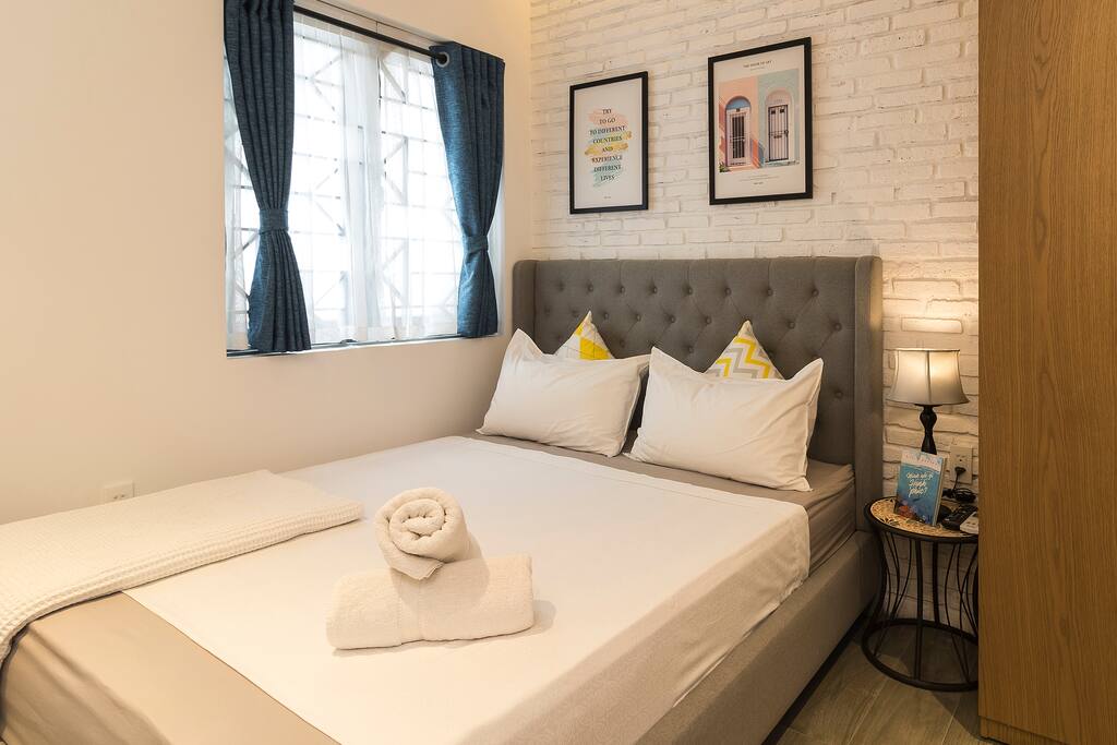 Queen-sized bed covered up by high standard Egyptian linens