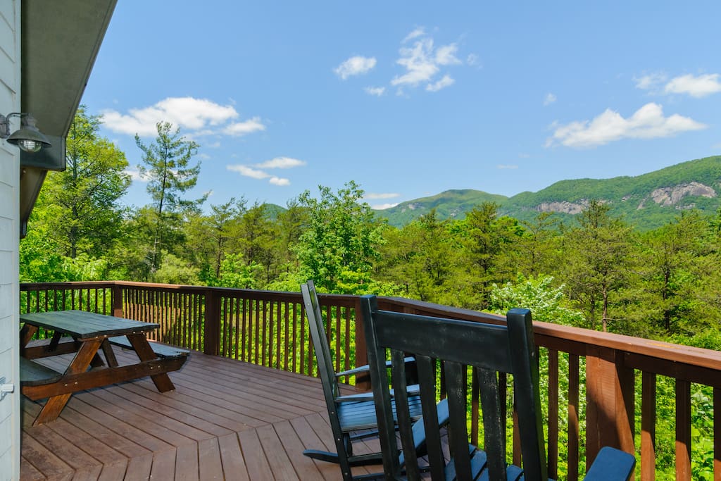 Main floor deck has picnic table, rocking chairs, charcoal grill and mountain views.