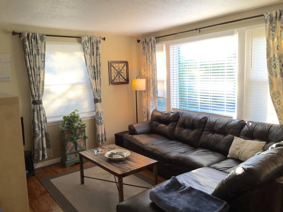 Comfy couch and plenty of natural sunlight in the living room!
