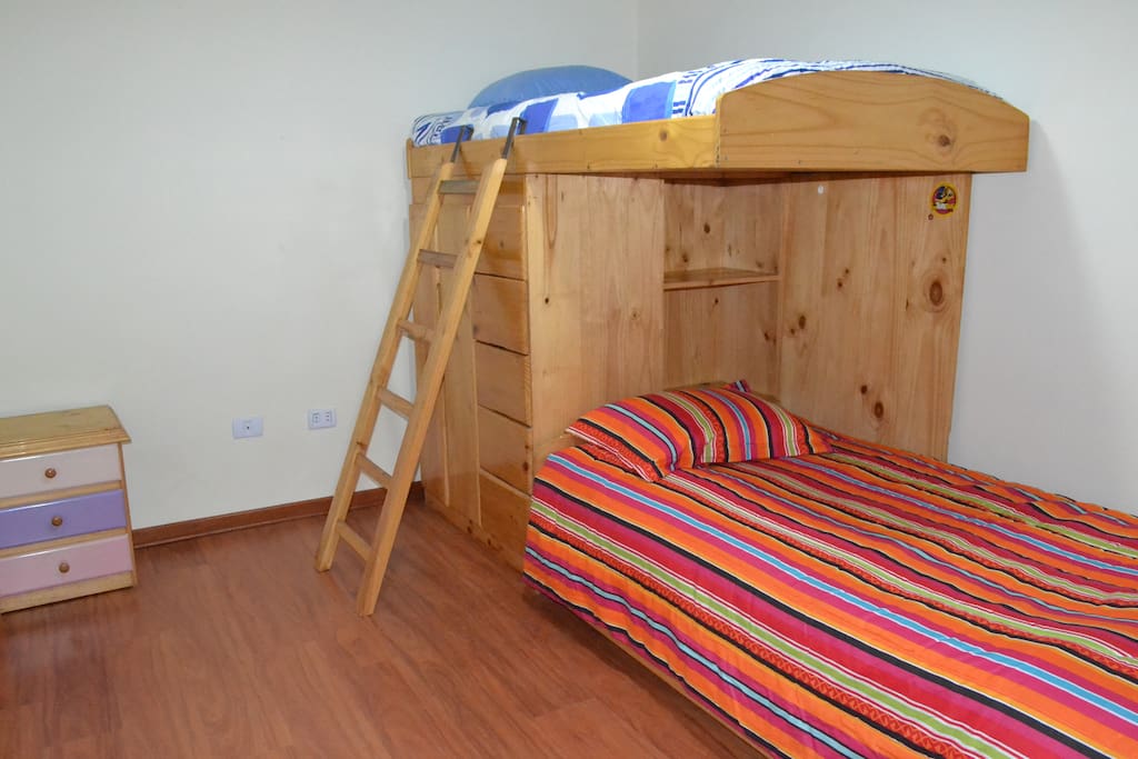 Trundle bed under bottom bed for extra person.