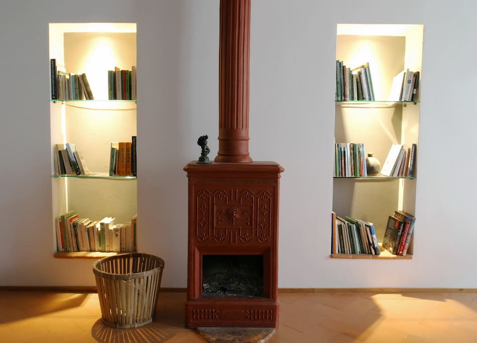 Woodstove-fireplace with wall book shelves