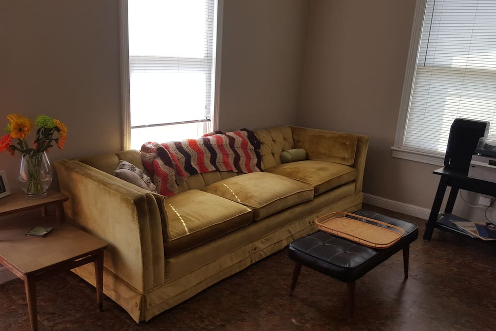 Very long, very comfy sofa that can accommodate a 3rd
