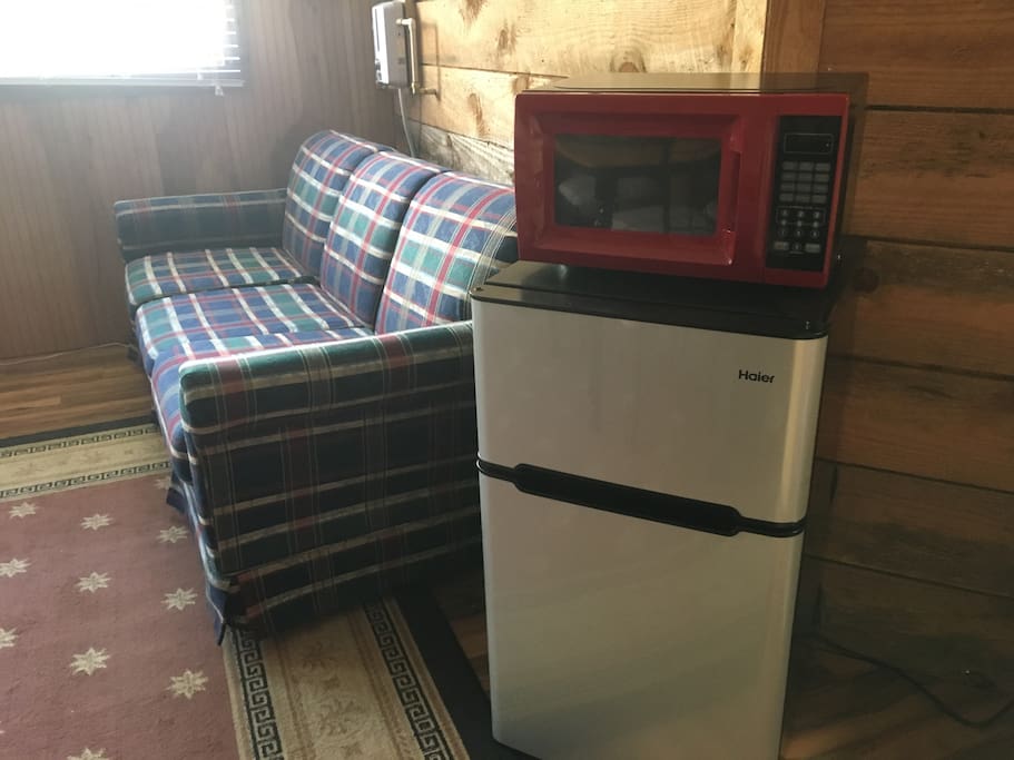 Sleeper sofa, microwave, mini fridge/freezer, Keurig & eating/drinking utensils.