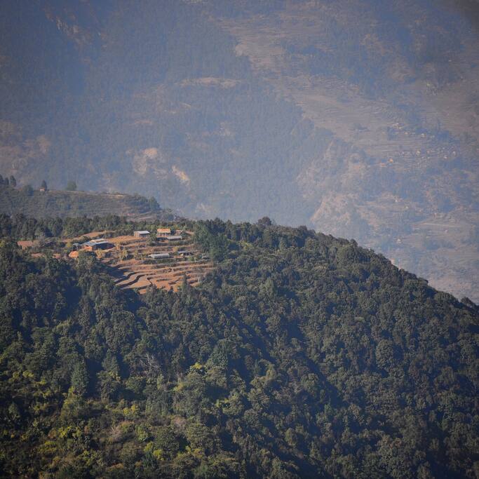 Adam Tribe stays alone on top of the mountain hill