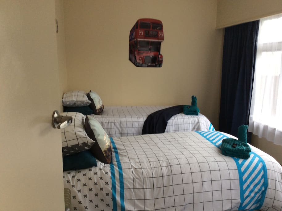 Bedroom #2
twin single room 2 x single beds a table and chair and wee side drawers between beds and oil heater for colder nights