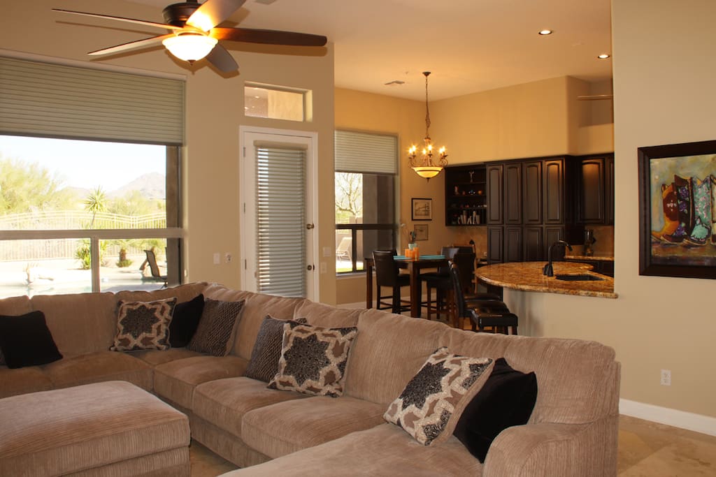Airy and comfy great room with beautiful travertine tiles & georgeous views thru windows.