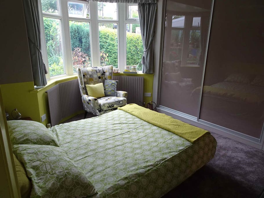 One section of the wardrobe (nearest the window) is for guests, with plenty of hanging and drawer space.