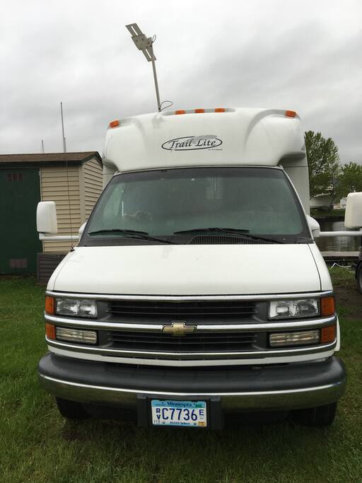 RV without window cover. Drapes cover storage in cab.