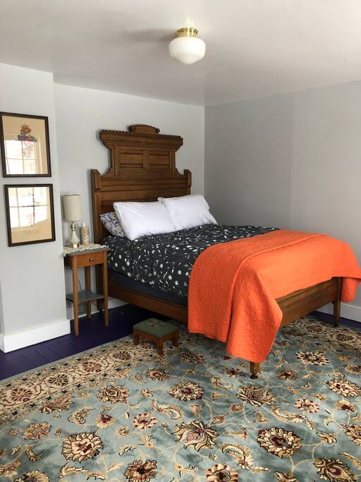 The front bedroom offers a full bed