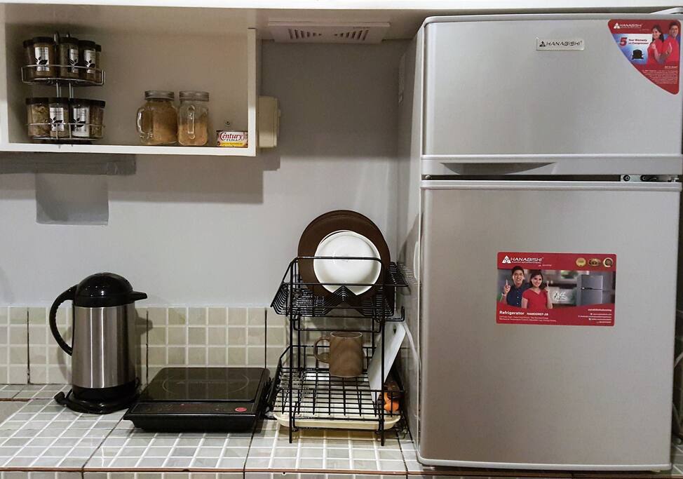 Kitchen utensils for your convenience. Electric Kettle, Induction Stove, Drip Coffee Maker, pans, dining wares