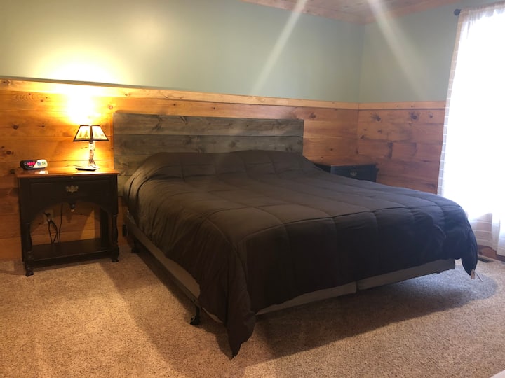 Master bedroom with king size bed. Also a flat screen smart tv! 