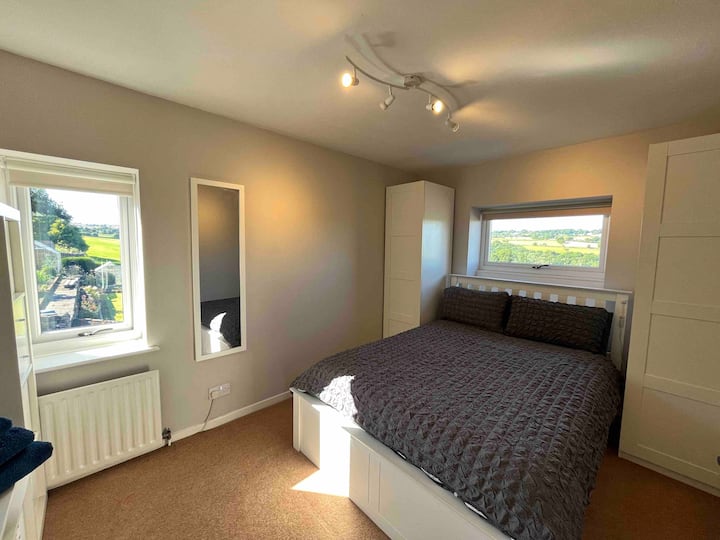 Main bedroom with double bed,  2 wardrobes, tv cabinet with storage and smart tv. 