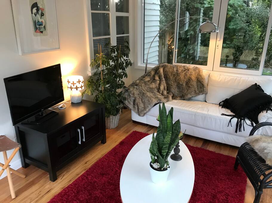 The sunroom, or conservatory, functions as lounge and TV room.