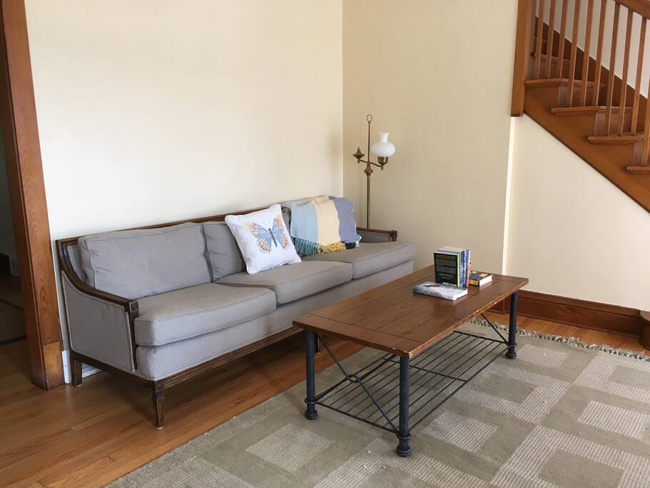 The living room provides plenty of seating and some books by local authors.