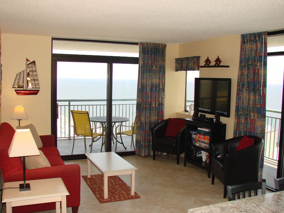 Wraparound balcony and ceiling-high windows bring the ocean closer.