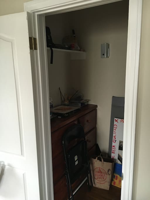 This is the closet in the living room which you are free to use. There's a drawer and a place to hang clothes.