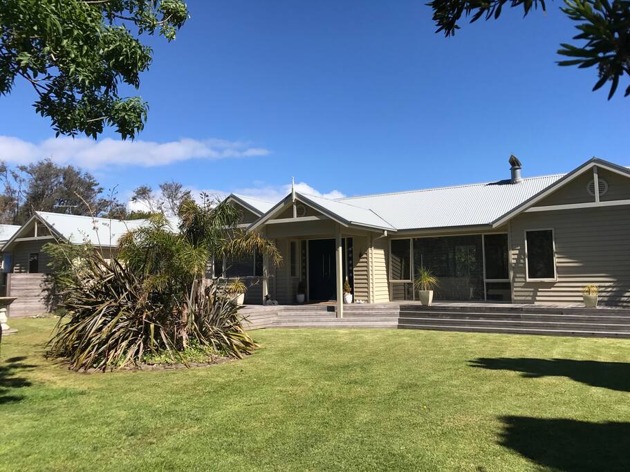 Front entrance and lawn car parking area.